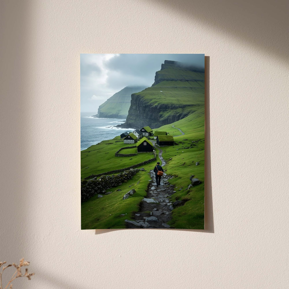 Landscape wall art print with green cliffs, village houses, ocean shoreline, and a hiker