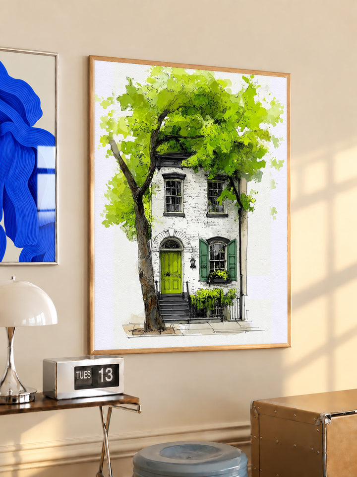 Framed watercolor townhouse print with leafy tree, green door, and white facade