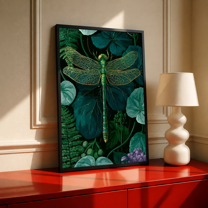 Framed green dragonfly botanical wall art with gold wing detail on a dark leaf backdrop