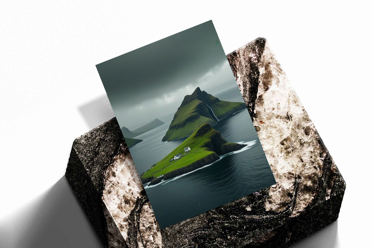 Green island cliffs and dark sea as an unframed print propped against a pale wall on a rough stone