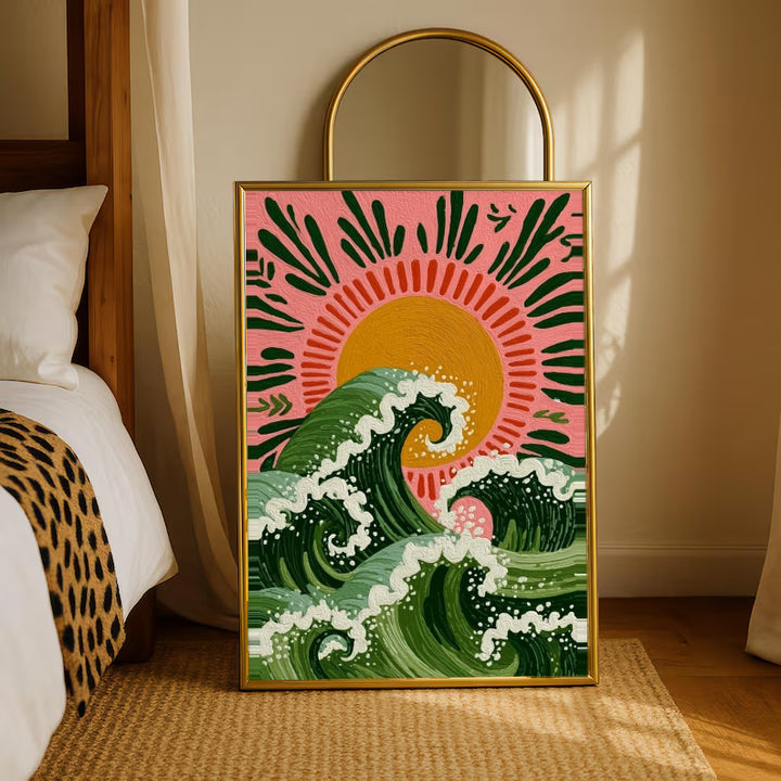 Curling green waves with cream foam beneath an orange sun on a pink background in a gold-tone styling frame leaning beside a bedroom mirror