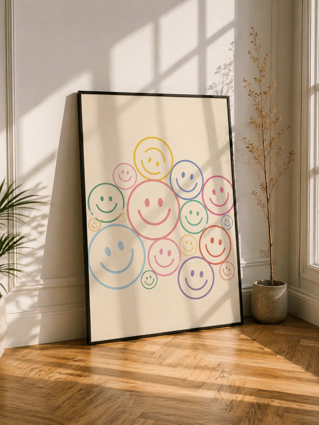 Black-framed smiley wall art print with multicolor happy faces on white