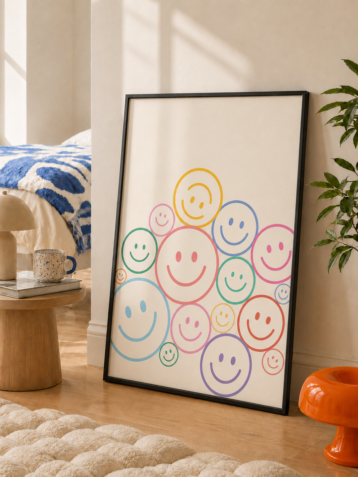 Framed smiley wall art print in black with colorful circular faces on white