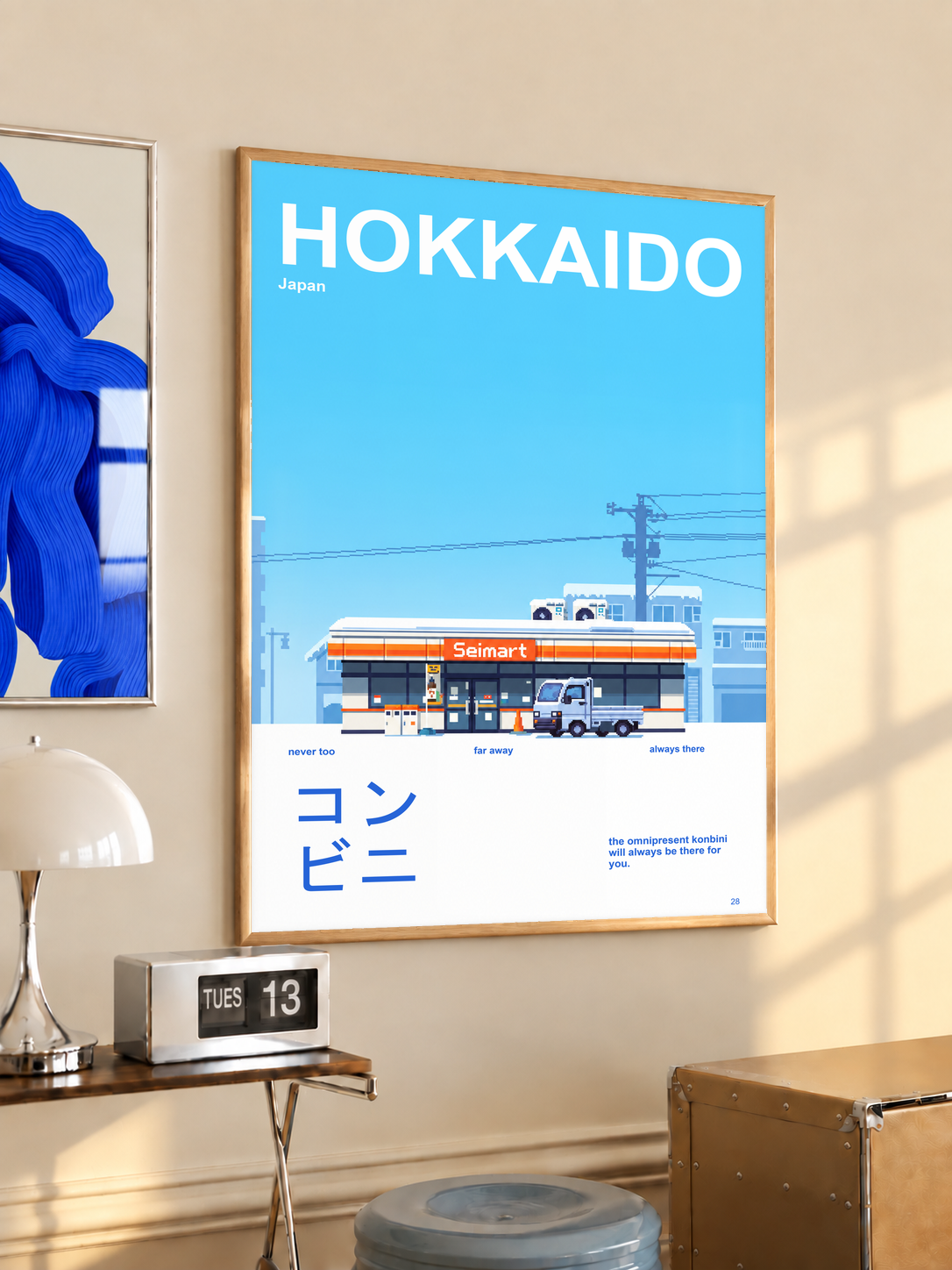 Hokkaido convenience store and small truck in a blue and white snowy landscape; oak framed print in a desk setting