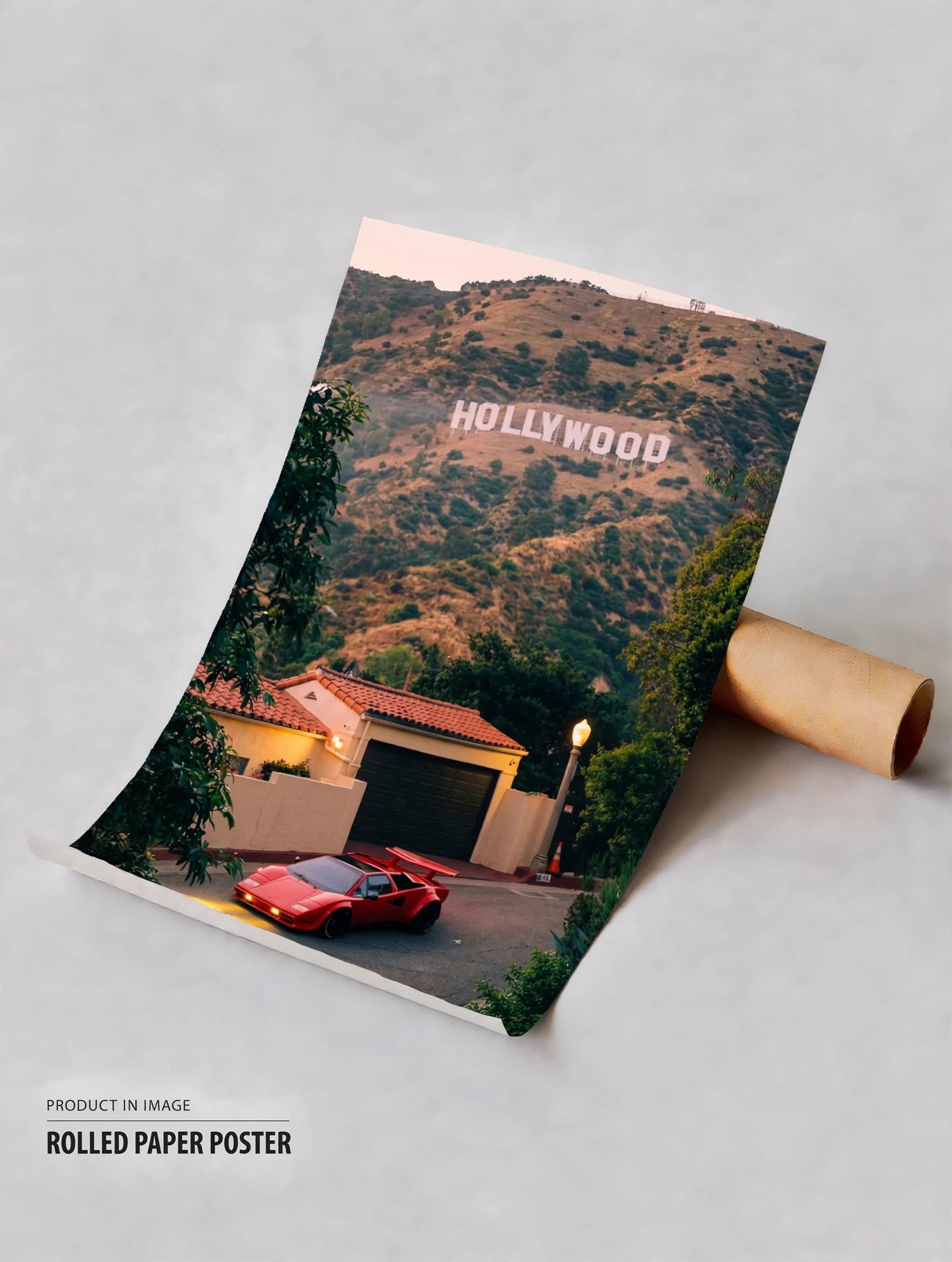 Rolled paper poster with Hollywood text over canyon house scene