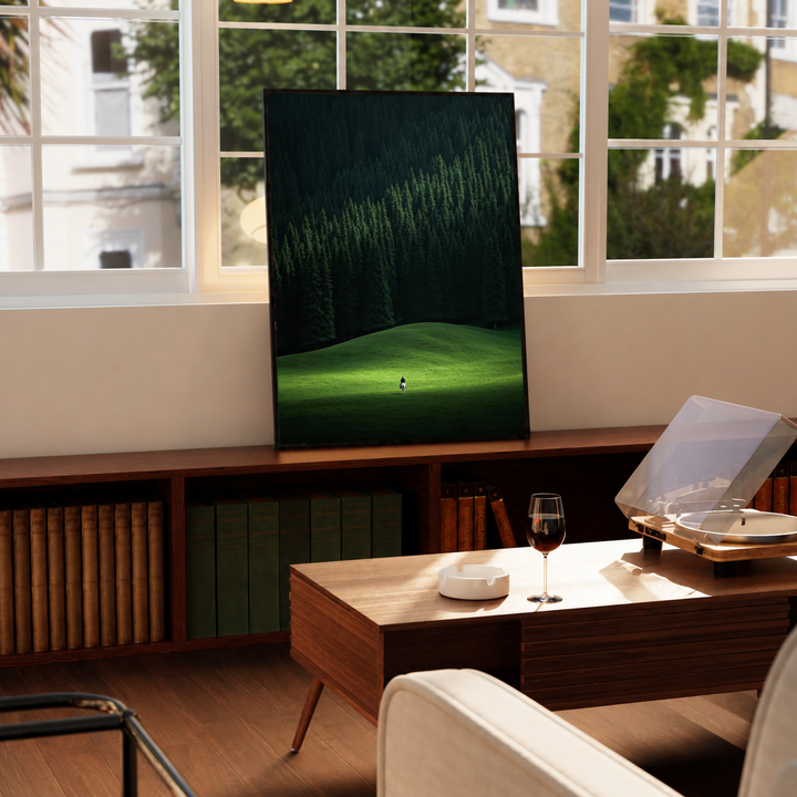 Horse Rider Forest Wall Art in a black frame near a window and wooden table in a sunlit sitting room.