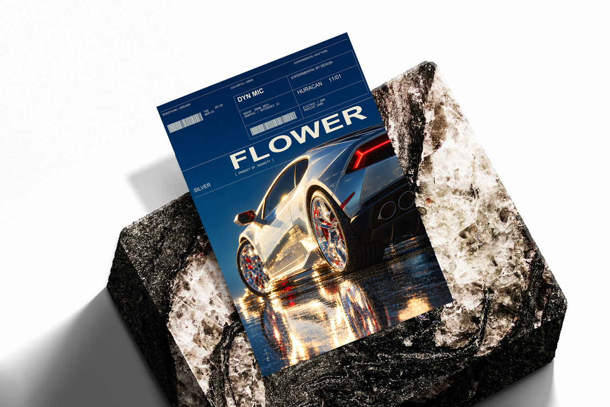 Silver Huracan with flowers around the rear wheel and night reflections; unframed print on a stone display