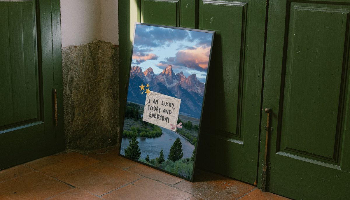 I Am Lucky Affirmation Poster shown as a canvas leaning beside green panels on a wooden floor.