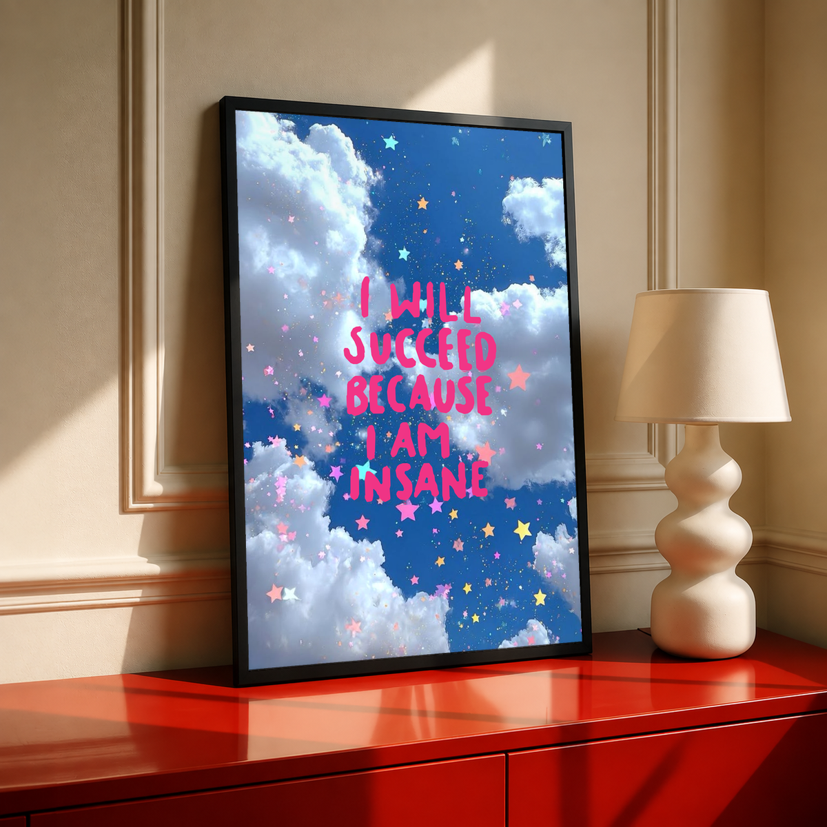 Standing framed poster with blue cloud backdrop, stars, and pink motivational text
