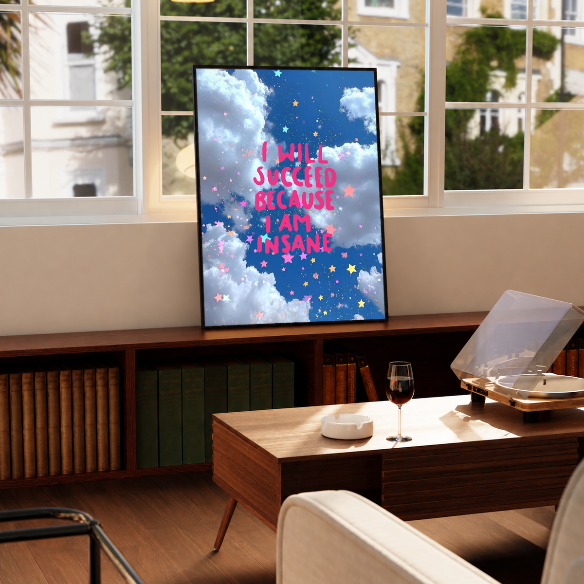 Framed quote poster with blue clouds and starry pattern, pink text on display