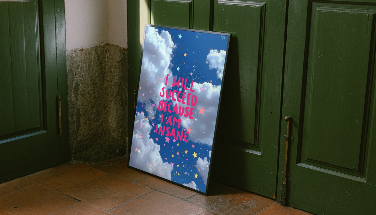 Framed poster leaning on floor by green doors; blue clouds and pink quote text