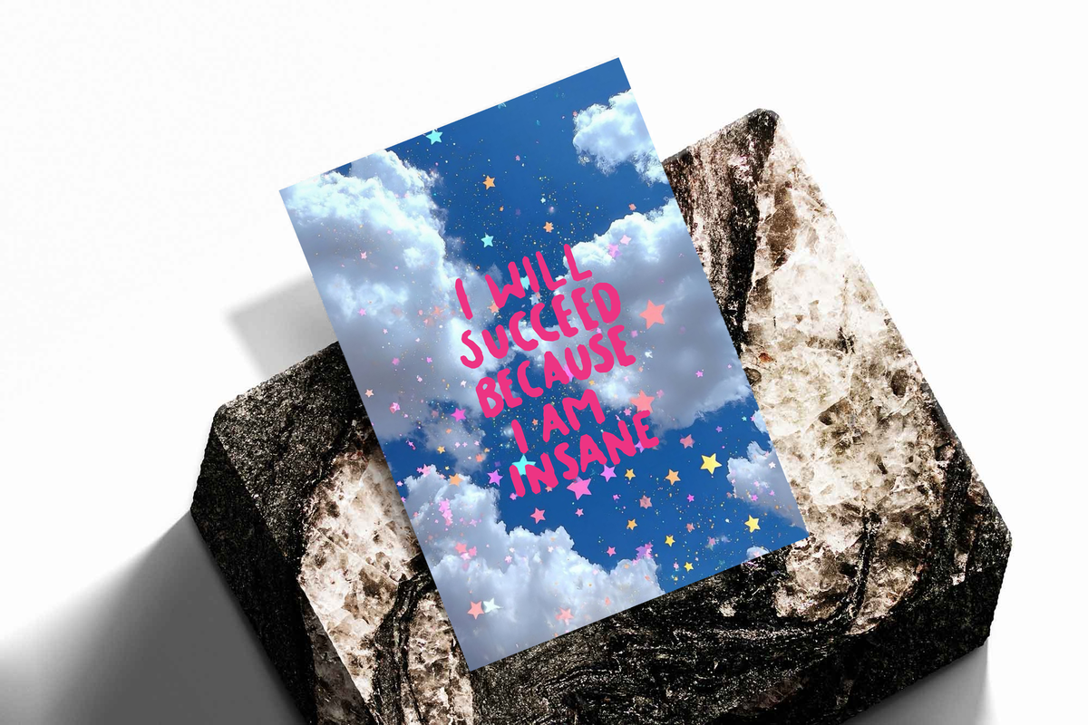 Poster print on textured surface with blue clouds, stars, and pink quote text