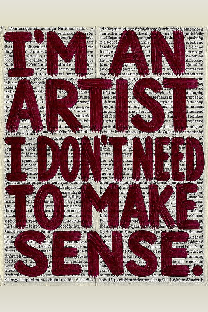 Newsprint quote poster close-up with burgundy brush lettering: I’M AN ARTIST, I DON'T NEED