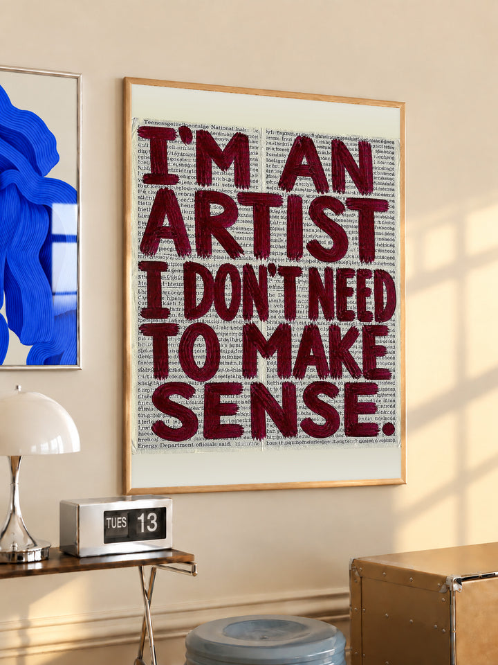 Burgundy quote lettering on newsprint poster, framed wall art with wooden border