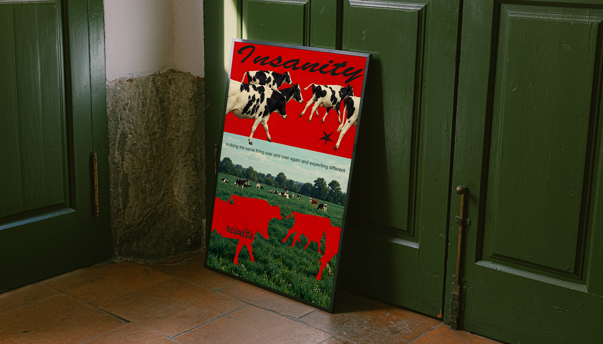 Red cow silhouettes and black and white cattle above a green pasture; unframed canvas styled by a green doorway