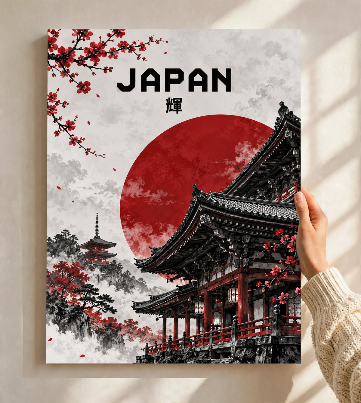 Close view of framed temple poster with red sun circle, black rooflines, cherry blossoms, JAPAN.