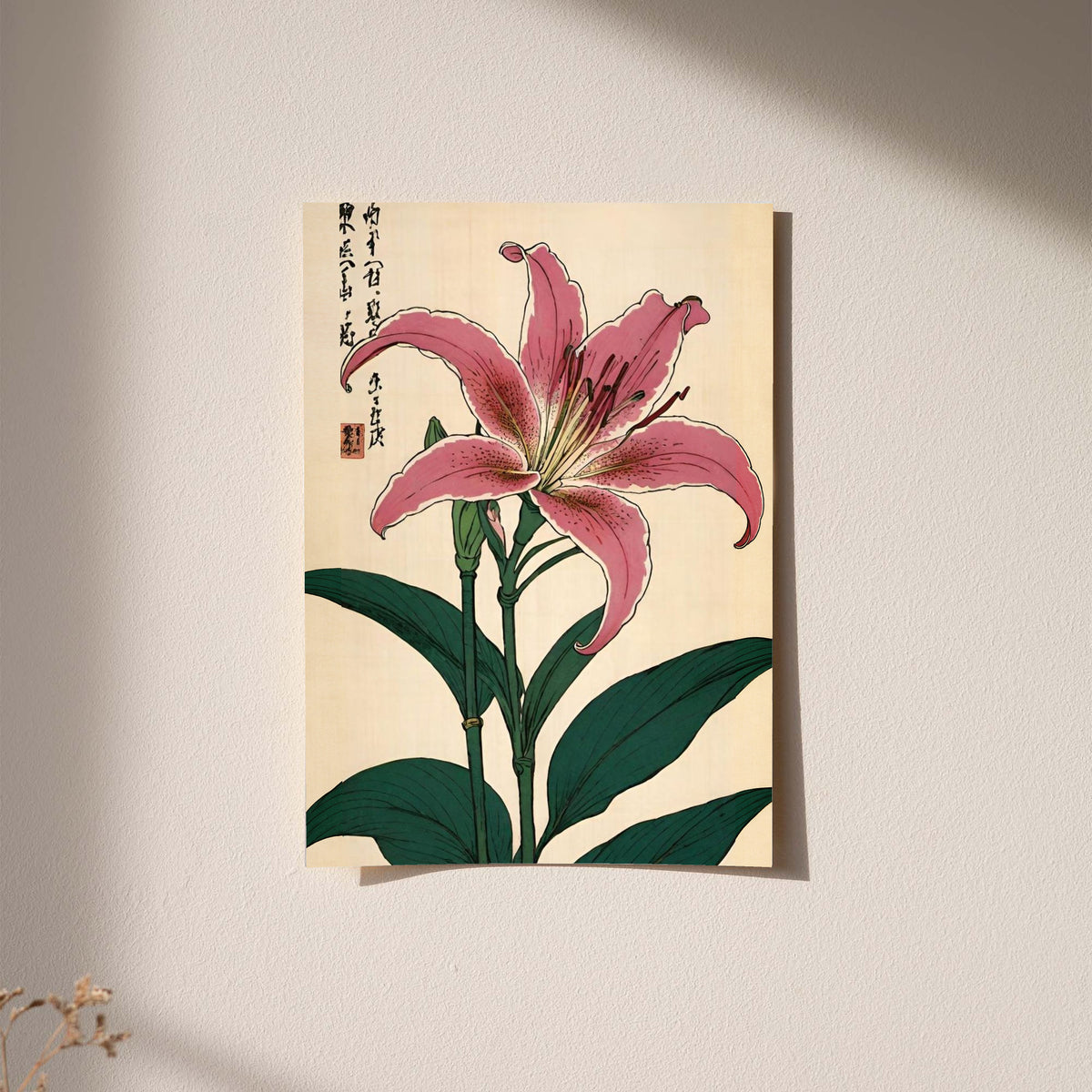 Pink lily with dark green leaves Japanese calligraphy and a red seal on cream as an unframed hanging paper print against a plaster wall