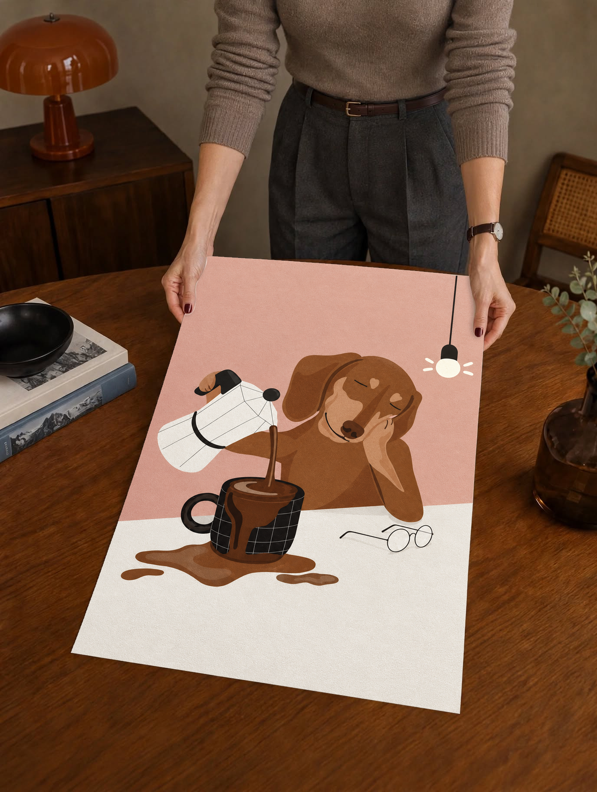 Coffee pour dog wall art on a table, pink background with brown dog holding coffee cup