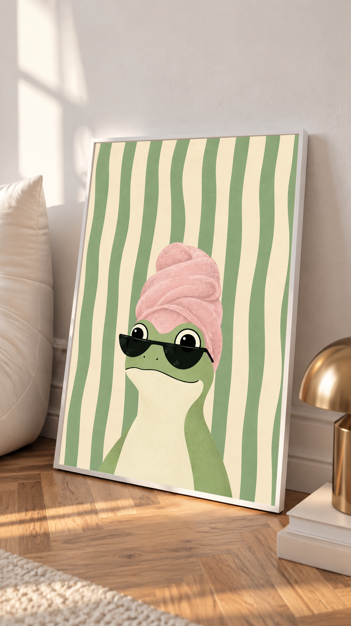White-framed frog print with a pink towel turban and black sunglasses on striped background