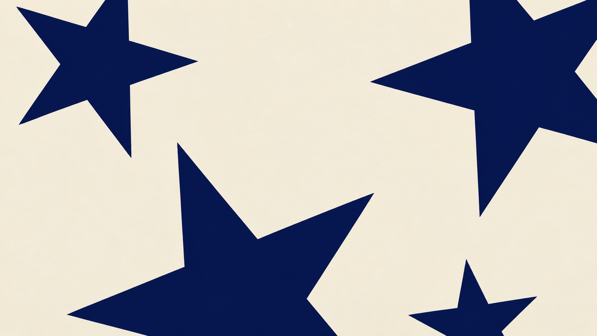 Close-up of oversized navy stars on a cream art print