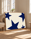 Horizontal art print with navy stars on a cream background in an oak frame
