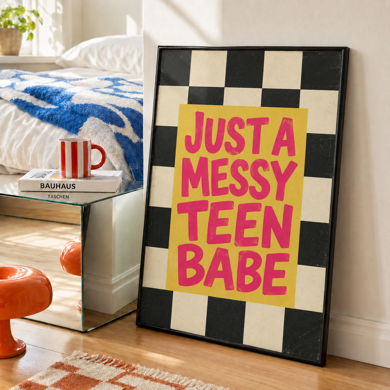 Black-framed wall art, checkered background with pink 'JUST A MESSY TEEN BABE' typography