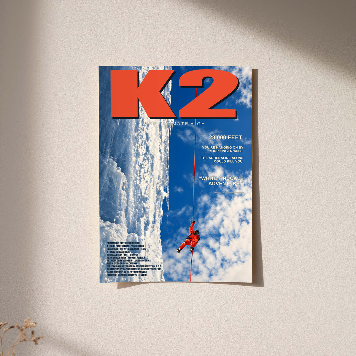 K2 mountaineering poster with red climber on a blue glacier wall