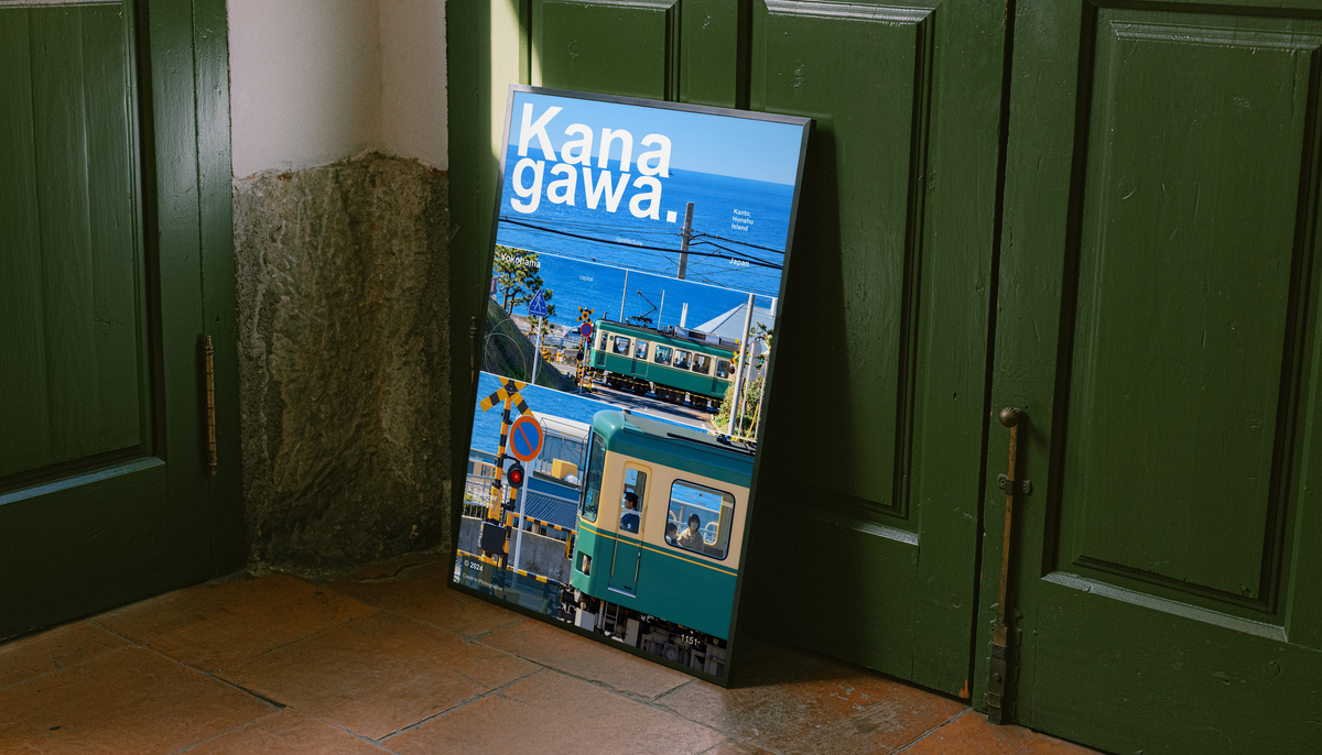 Green coastal train with blue sea and railway crossing in Kanagawa; unframed canvas styled by a green doorway