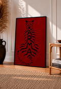 Black-framed deep red poster featuring black feline typography, vertical layout.