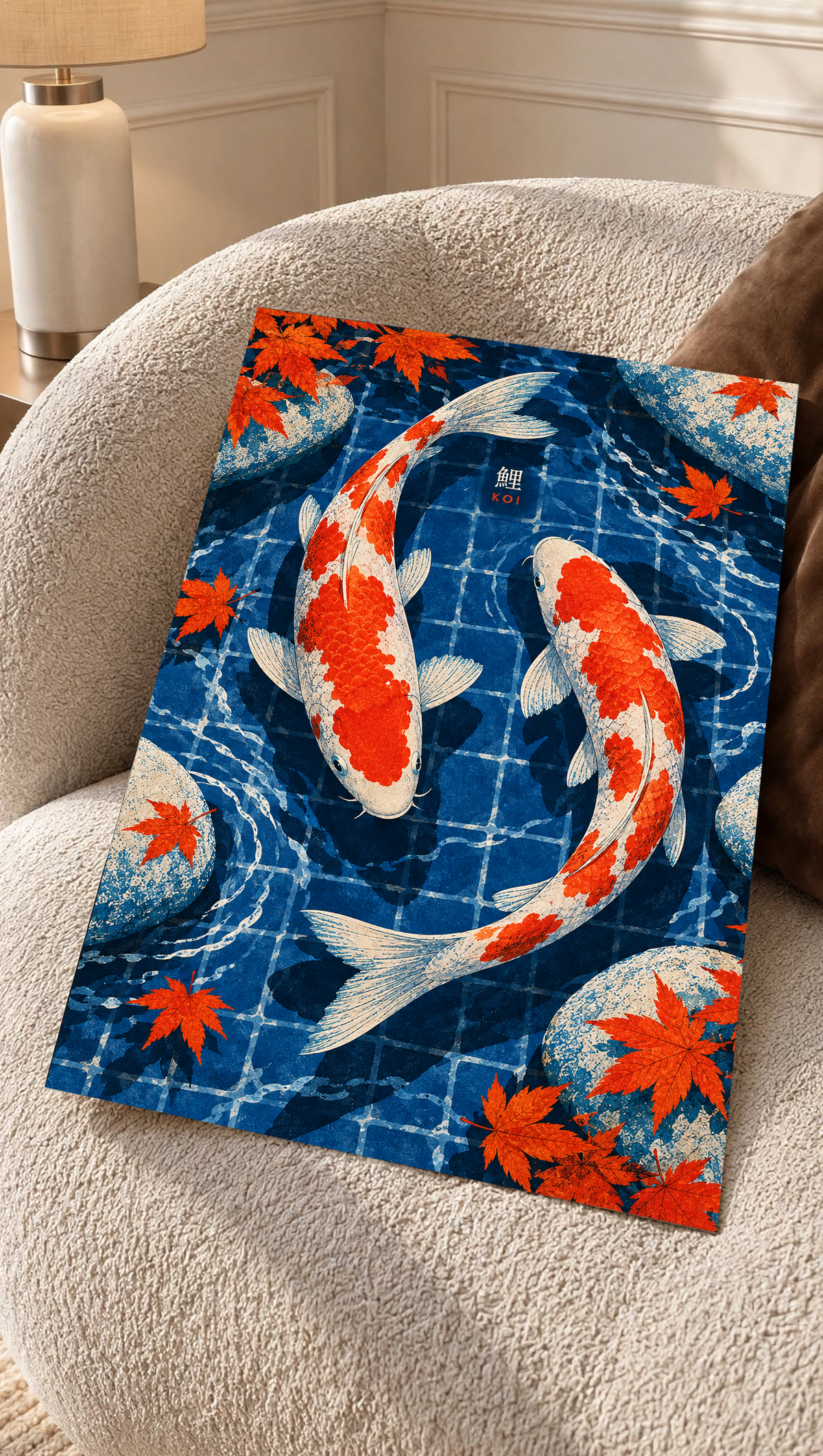 Koi pond art print leaning on a couch, with red-and-white koi and orange maple leaves
