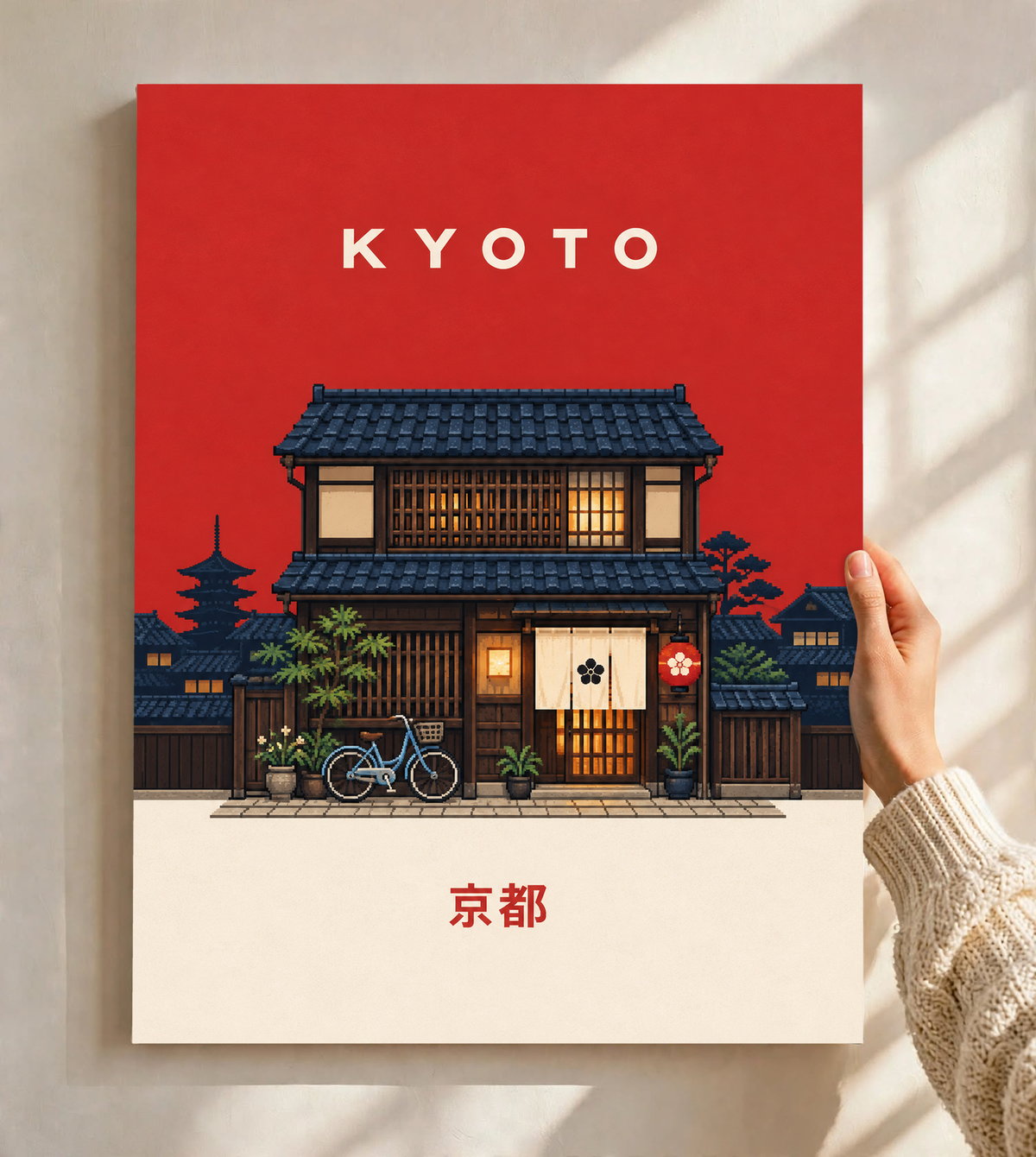 Close-up KYOTO poster with red sky, lit machiya house, bicycle, and Japanese text.