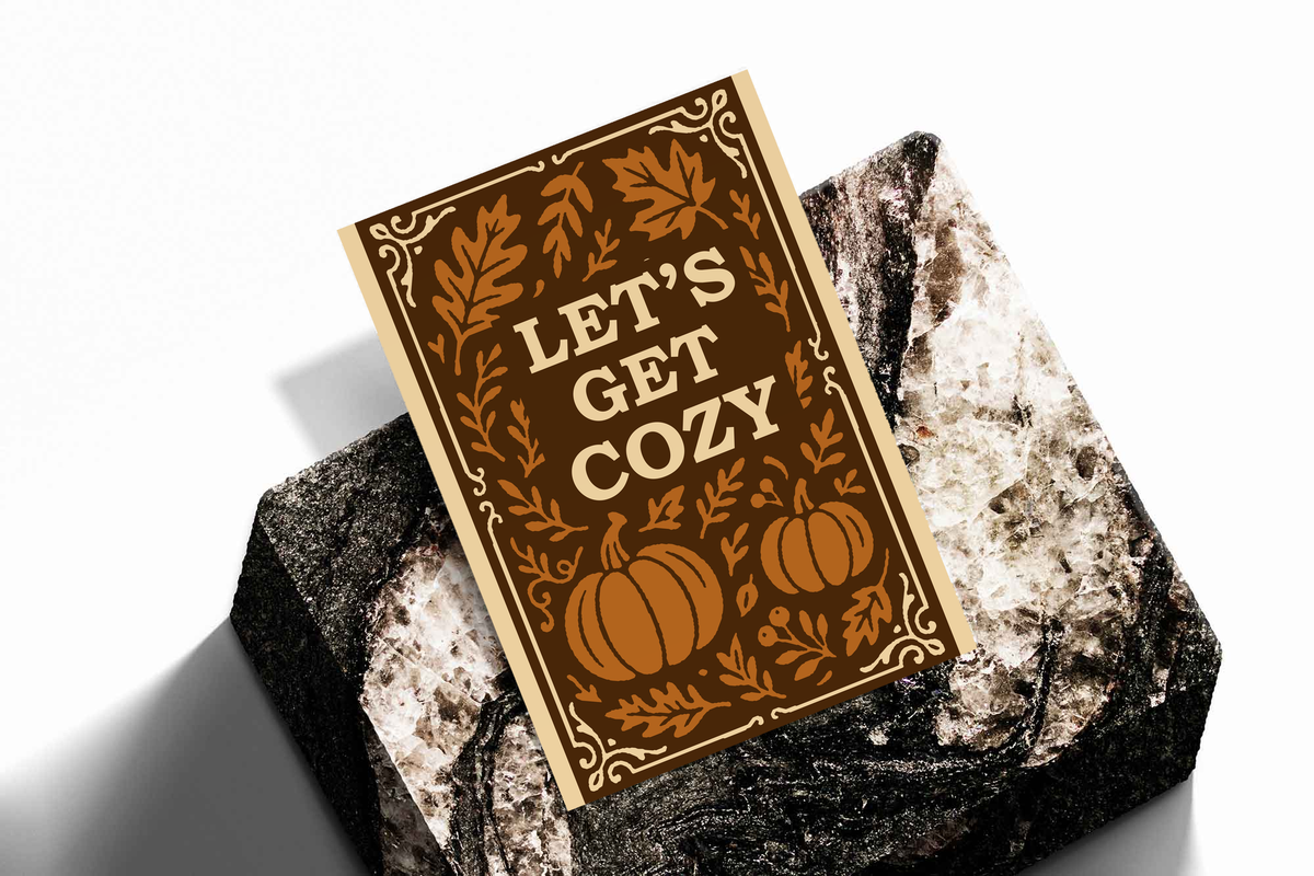 Autumn framed poster with cream border, brown foliage and pumpkins, “Let’s Get Cozy”