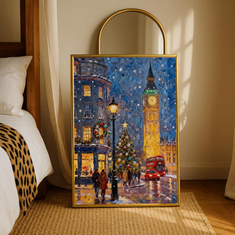 Gold-framed print of snowy London night with Big Ben, festive trees, and red double-decker bus.