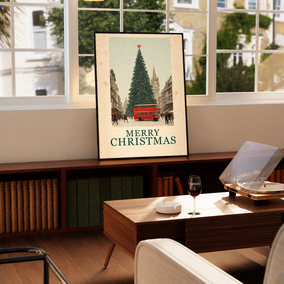 Black-framed Christmas poster with red bus, tall pine tree, and “MERRY CHRISTMAS”
