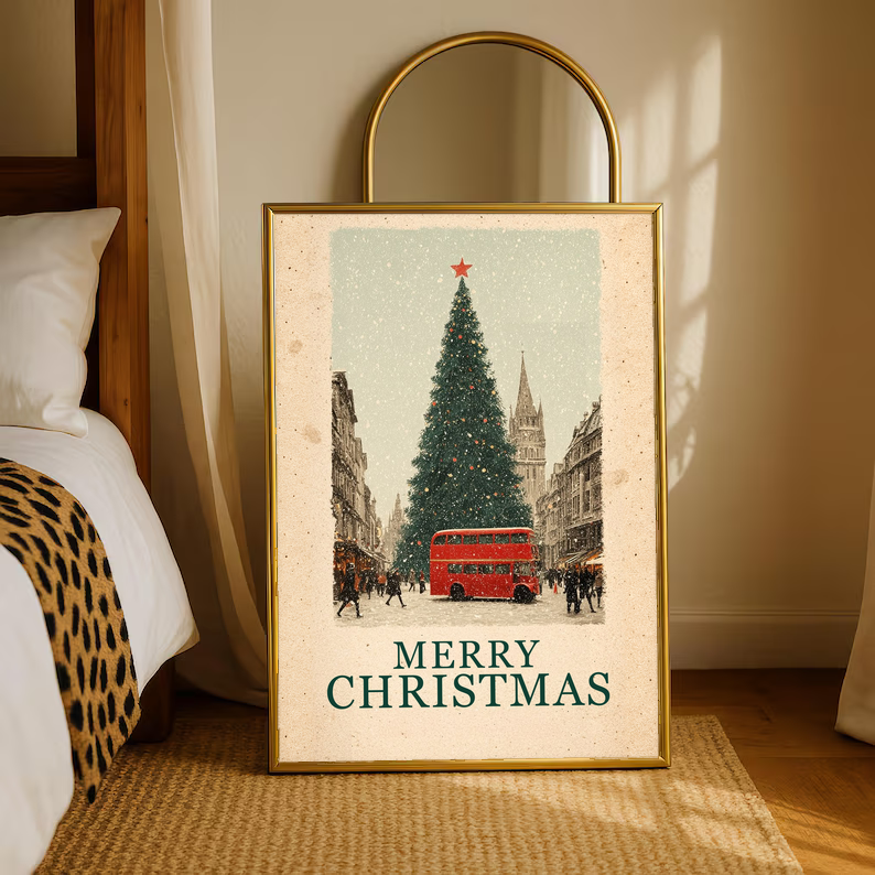 Gold-framed Christmas poster with red bus, evergreen tree, and “MERRY CHRISTMAS” lettering