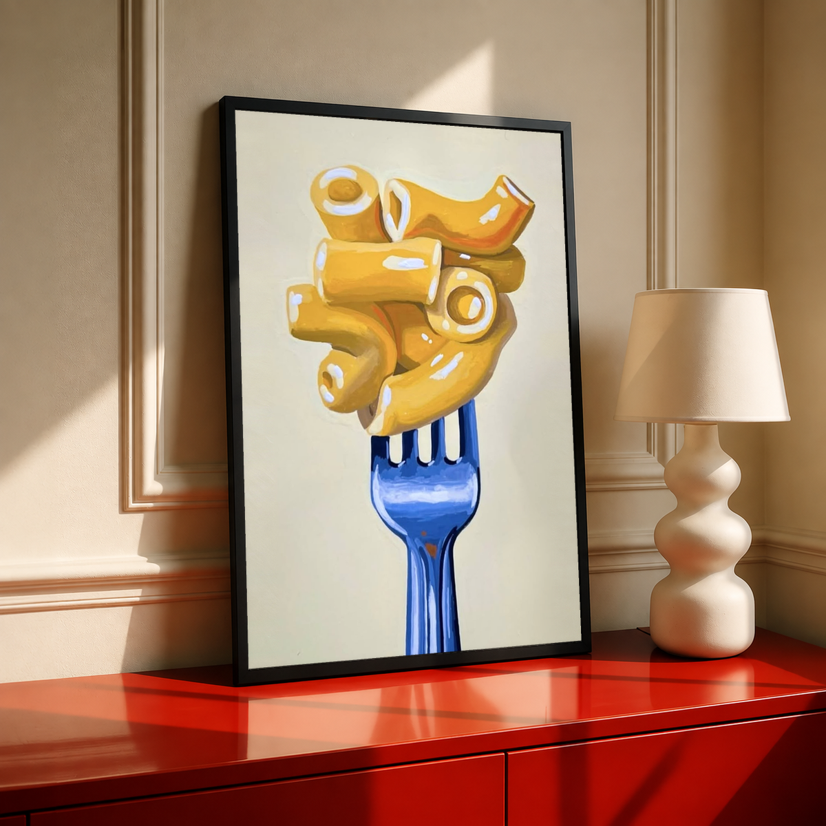 Framed wall art print featuring golden macaroni on a blue fork on a cream background