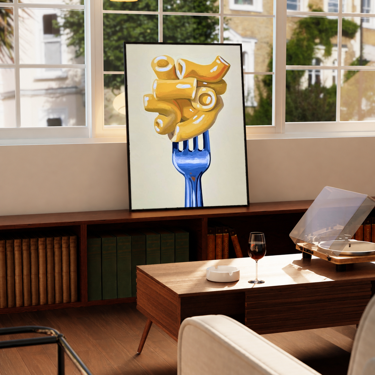 Framed wall art print with golden macaroni on a blue fork on a cream background
