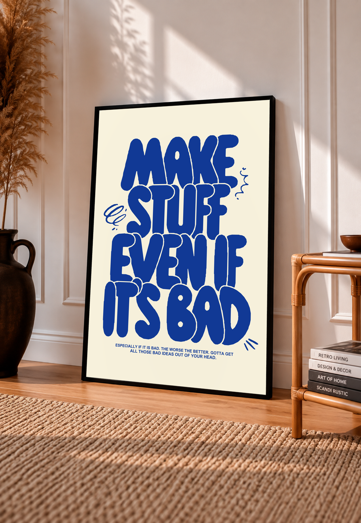 Framed cream poster with bold blue stacked lettering and small footer text.