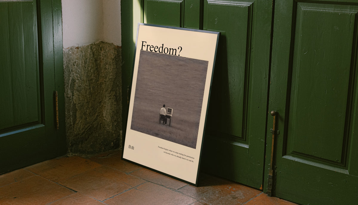 Unframed art poster leaning on green doors, “Freedom?” title and man at desk
