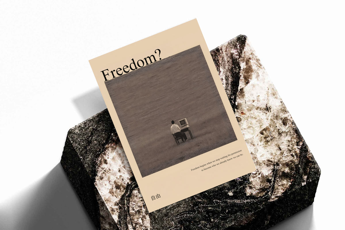 Poster print tilted on rock surface, dark desk scene with “Freedom?” at the top