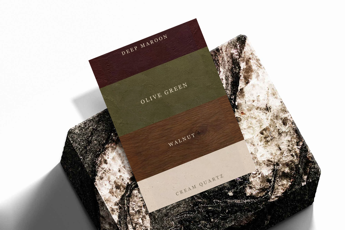 Color palette poster stacked on textured surface, featuring Deep Maroon, Olive Green, Walnut, Cream