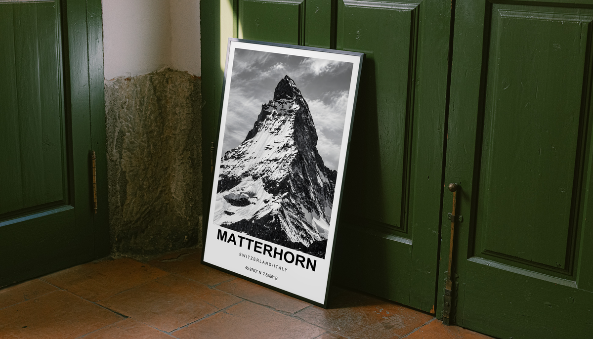 High-contrast black and white Matterhorn peak with bold caption and white border; unframed canvas styled by a green doorway