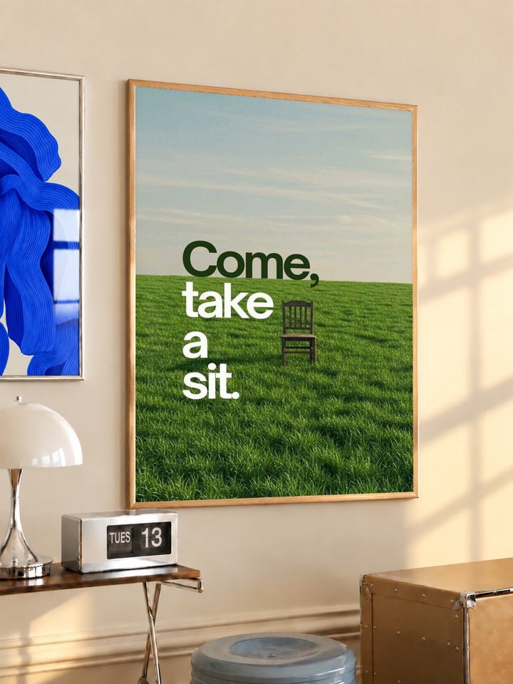 Landscape quote poster with green grass, small chair, and text "Come, take a sit."