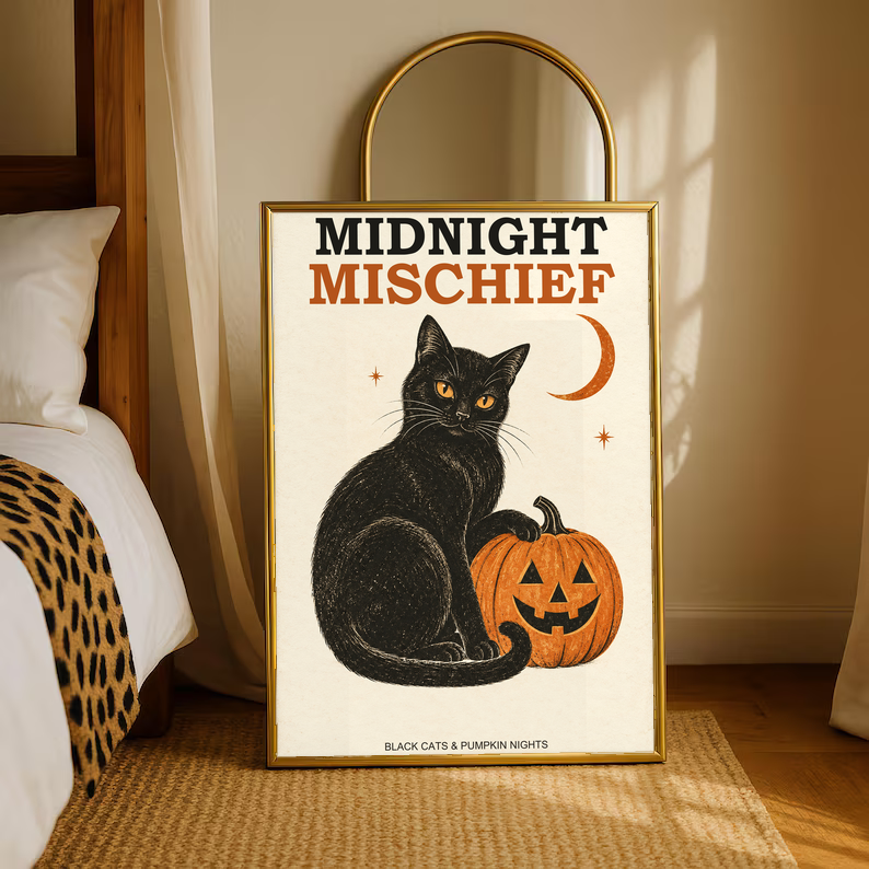 Gold-framed Halloween poster with black cat, orange jack-o’-lantern, and crescent moon.