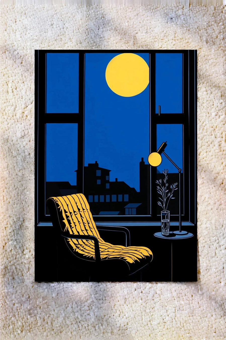 Framed wall art with blue window scene, yellow sun, black city skyline and chair