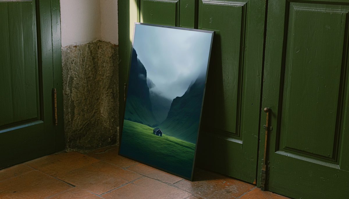 Canvas-style mountain valley print with misty blue mountains, green slopes, and small cabin