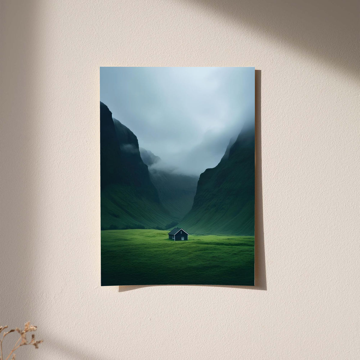 Light-framed mountain valley wall art with misty sky, green slopes, and small cabin