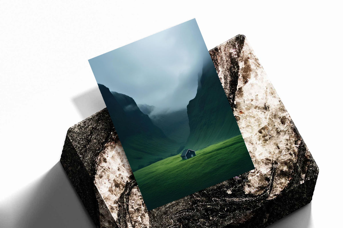 Unframed mountain valley print on textured base with misty blue peaks and small cabin