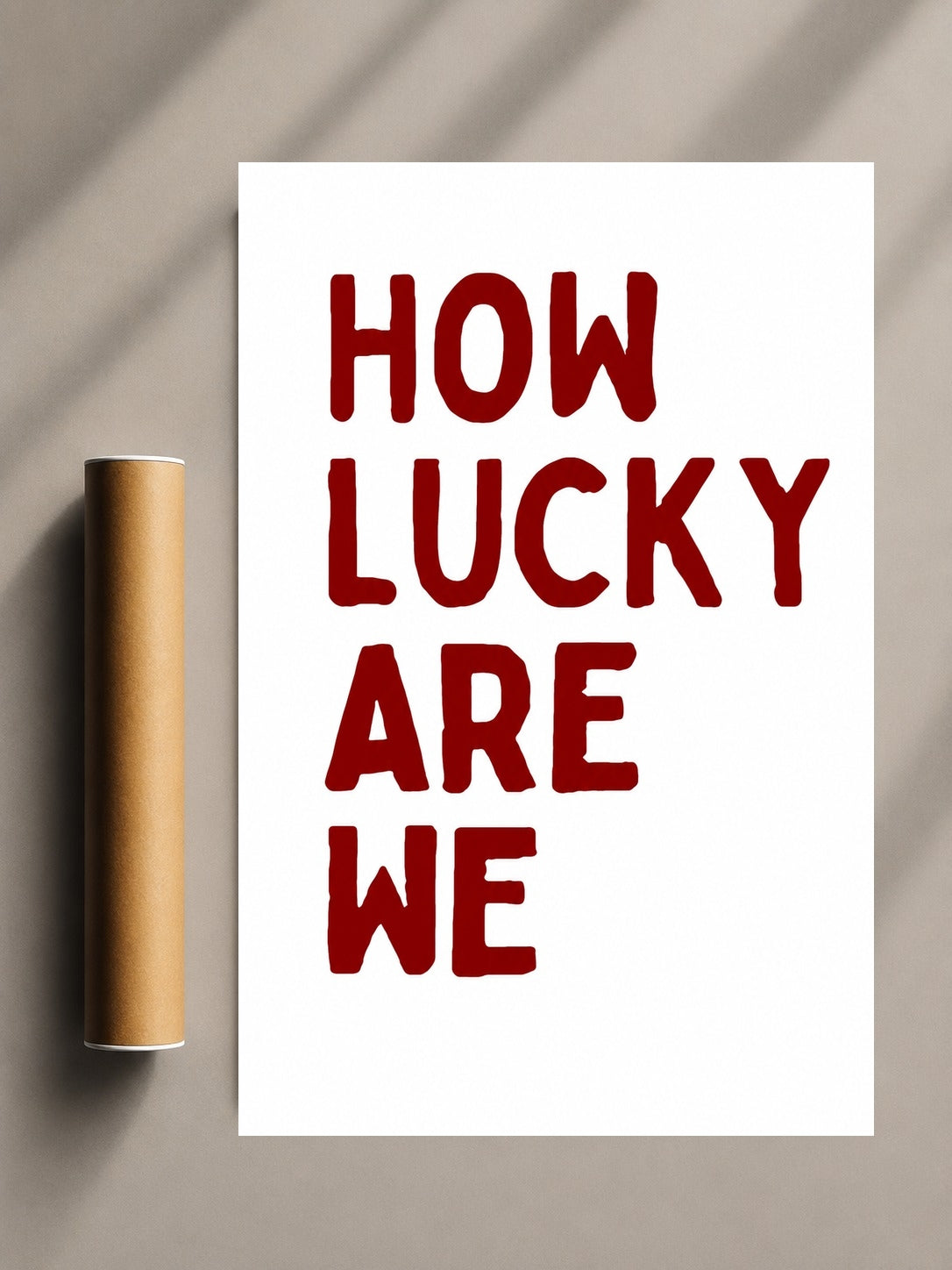 Romantic quote print with red “HOW LUCKY ARE WE” text on white sheet