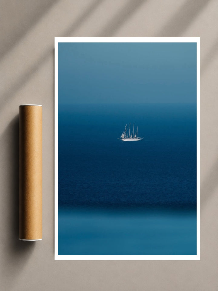Minimalist Sailboat Print with a lone white sailboat floating across a deep blue sea beneath a clear horizon.